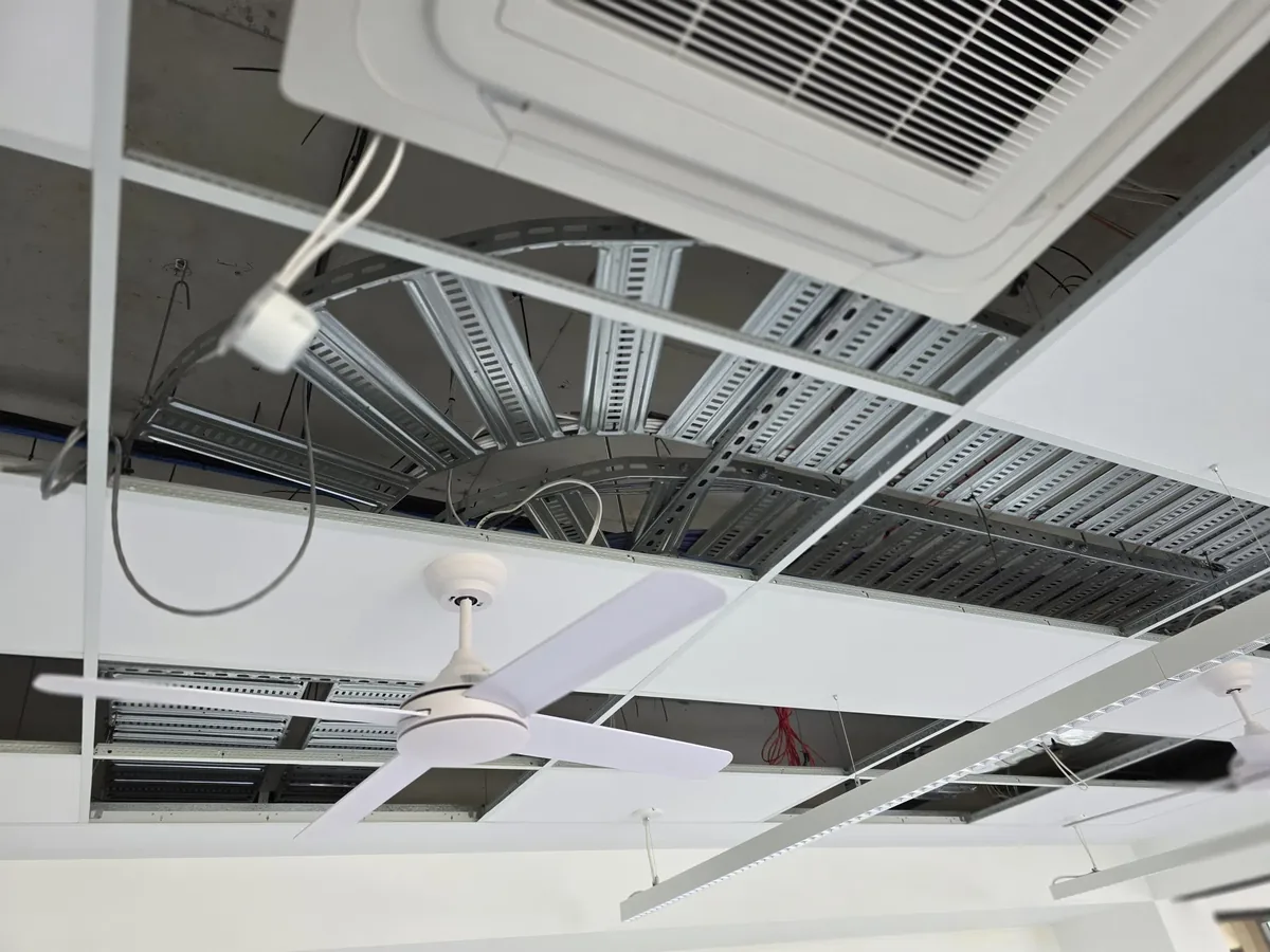 Ceiling-mounted wireless access point with cabling run to the comms cabinet